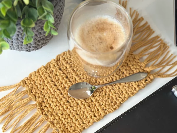 "Handmade cotton coaster featuring a durable, eco-friendly design perfect for protecting surfaces from cups and glasses.